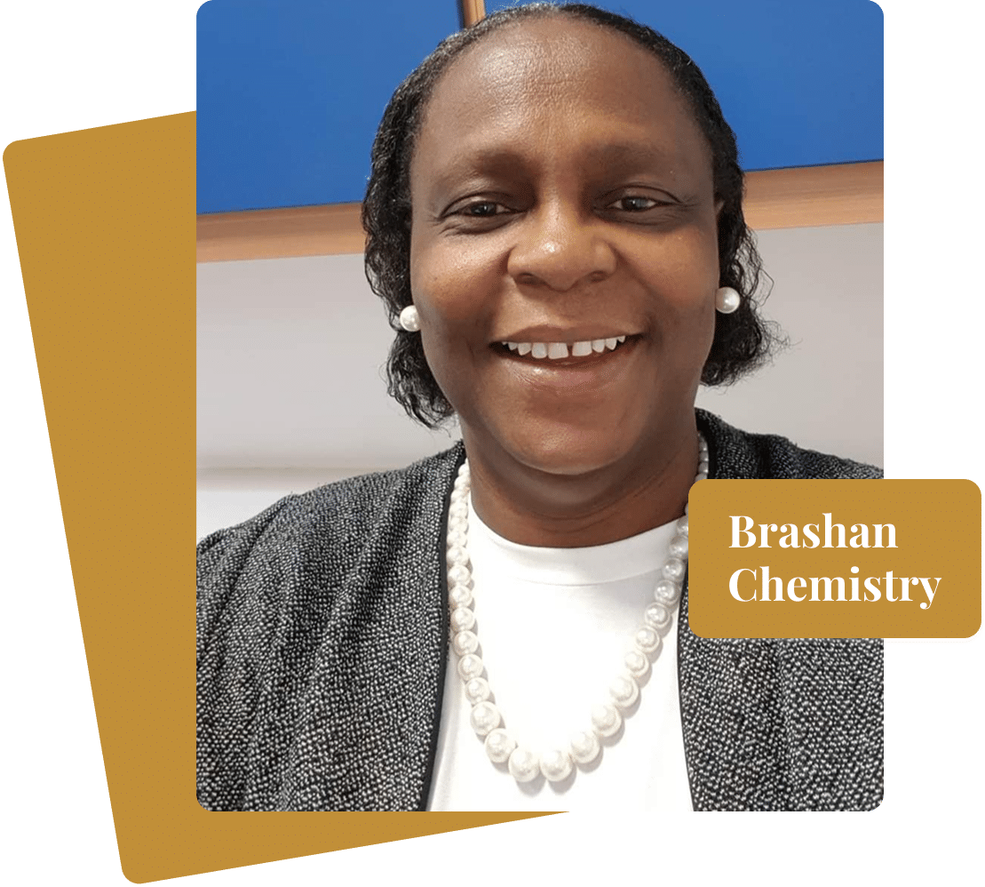 Erada smiling in a professional headshot with pearl earrings and necklace, Brashan Chemistry label overlay